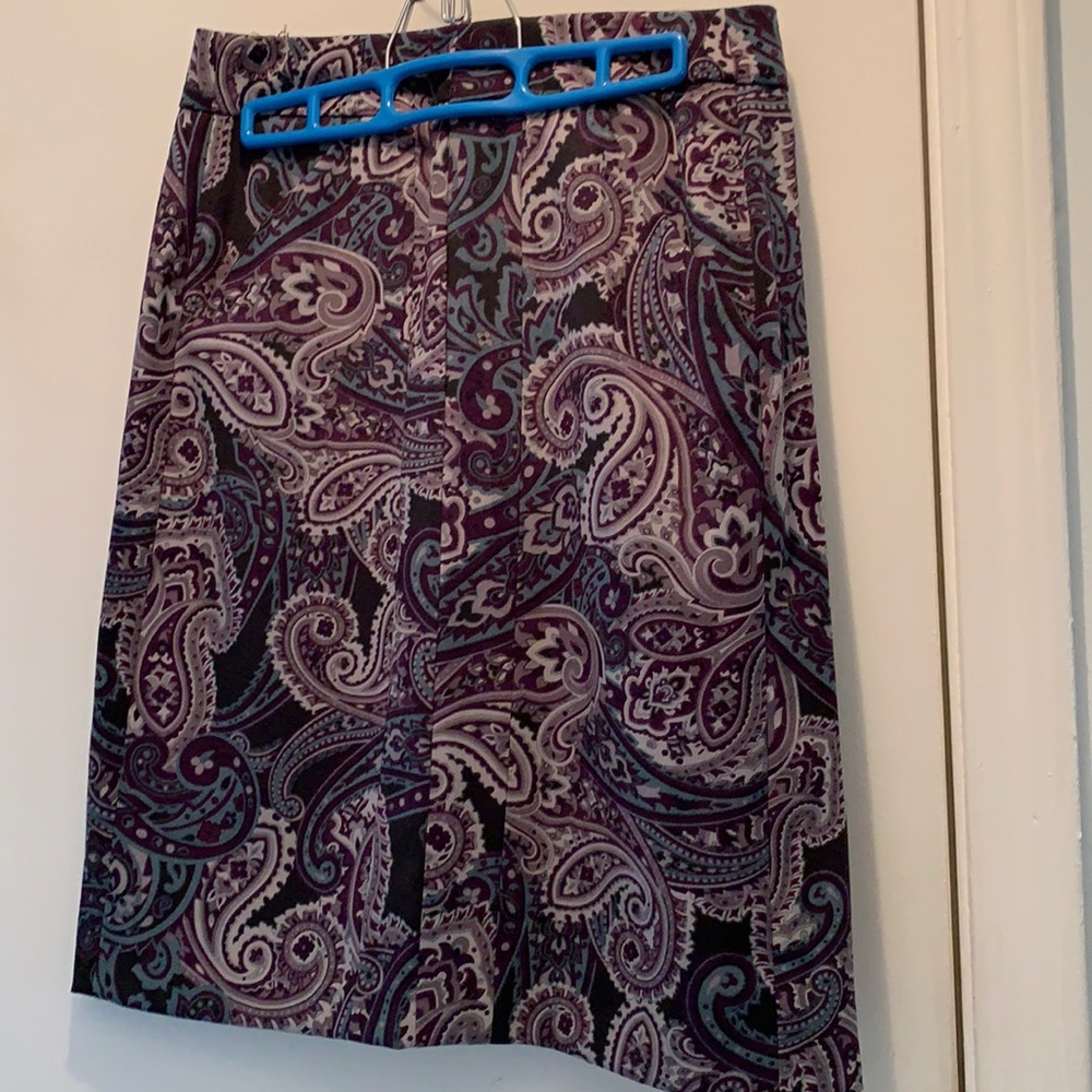 A-line shape above the knee length skirt.